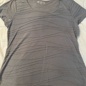 Cute, fun top with detailing on the front!